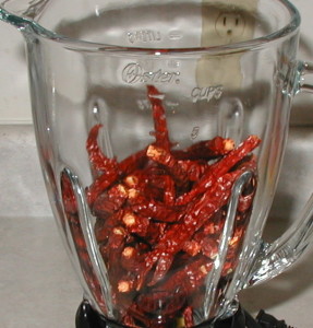 Dried peppers in a grinder or blender.