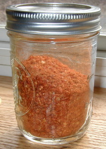 Ground peppers in a mason jar.