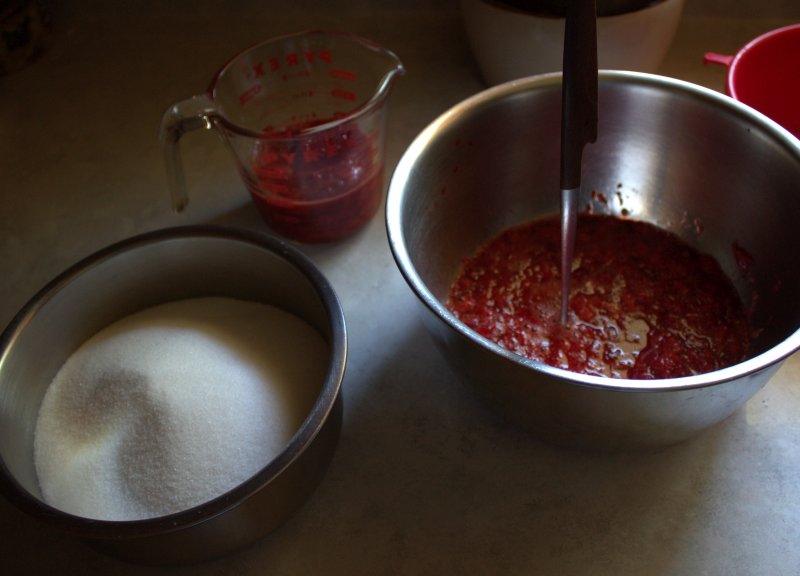 Crushed fruit and sugar for jam.